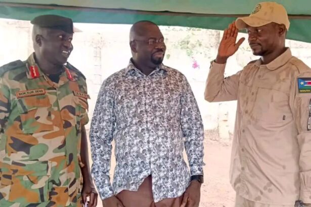 Badur Emmanuel Dominic Dismo salutes SSPDF officers after defecting from SPLM-IO in Western Equatoria State.